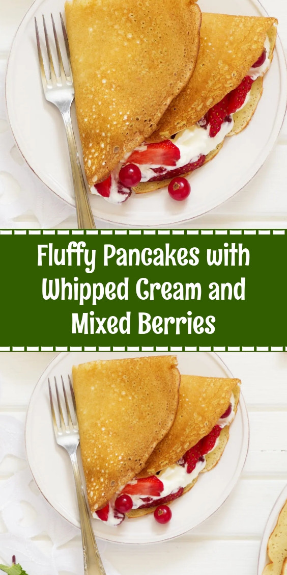 Fluffy Pancakes with Whipped Cream and Mixed Berries